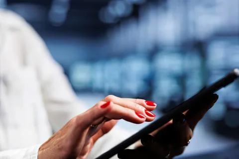 Person using tablet in professional kitchen Stock Photos