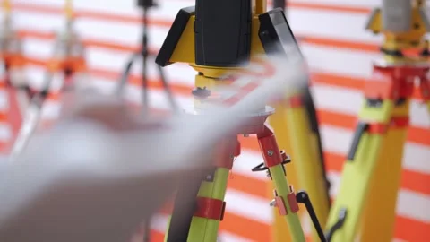 Person is using a tablet to read a device that is on a tripod Stock Footage 310838766