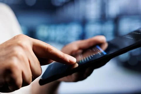 Person using tablet with stylus in office Stock Photos