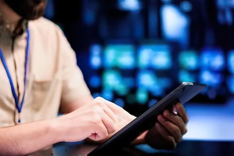 Person using tablet at tech conference Stock Photos