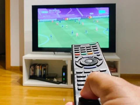 Person using the television remote Stock Photos
