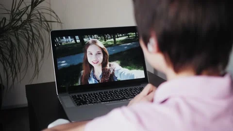 Person using video call at home to connect with relatives at home during covid Video stock 140608913
