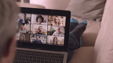 Person Using Video Conferencing technology in kitchen for video call with collea Stock Footage 127685272