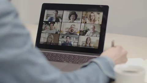 Person Using Video Conferencing technology from sofa for video call with colleag Video stock 127685424