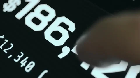 Person views financial data on digital device screen, macro view Stock Footage 333400356