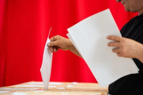 Person votes during elections Фото