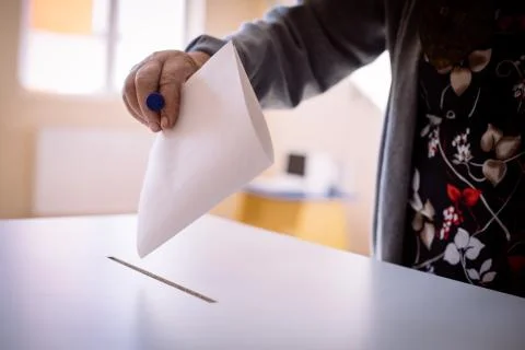 Person voting, casting a ballot Stock Photos