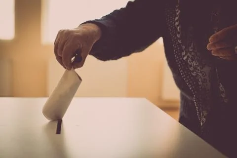 Person voting, casting a ballot Stock Photos