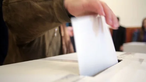 Person voting at polling station Stock Footage 70581341