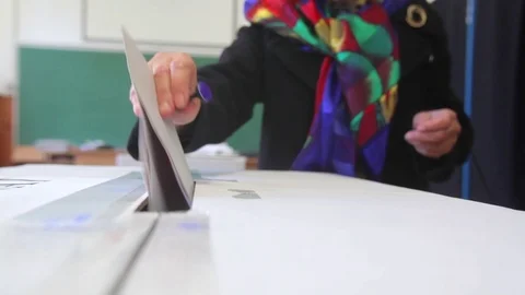 Person voting at polling station Stock Footage 70581342