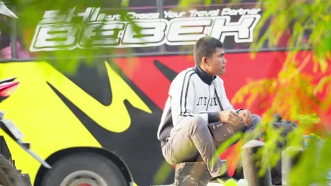 Person Waiting for a Bus by the Roadside Stock Footage 346014812