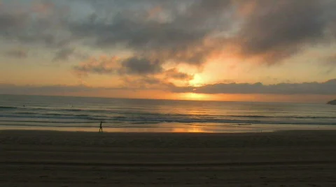 Person walking alone on a beach Stock Footage 198006