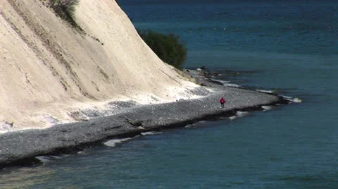 Person walking on beach Stock Footage 22605378