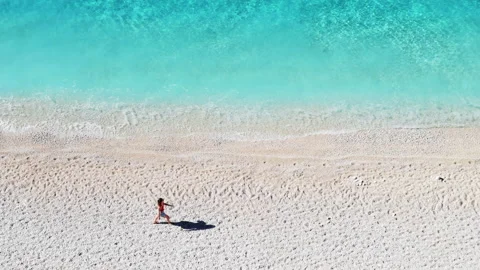 A person walking on a beach. Stock Footage 220024644