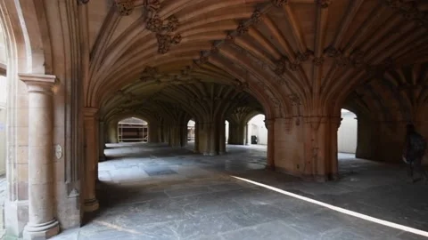 Person walking between columns beneath cathedral in London England Stock-Footage 151925752