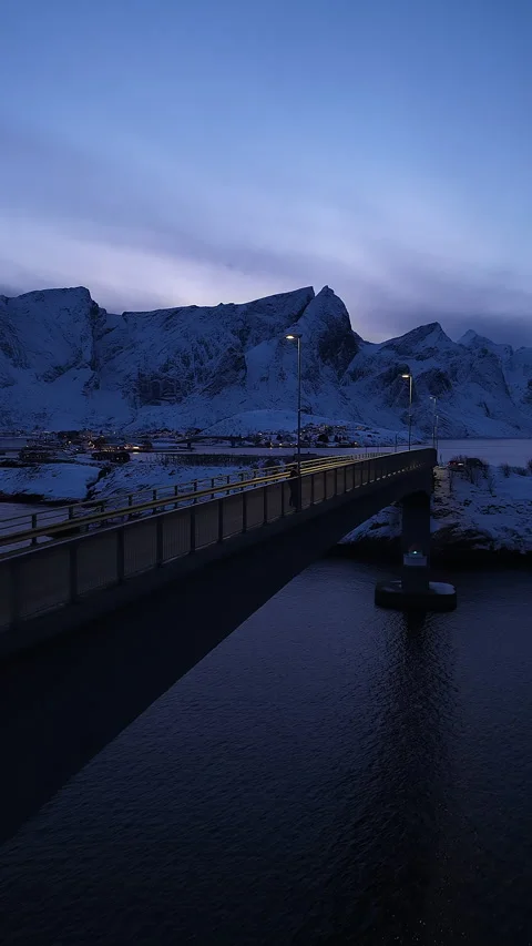 Person walking on bridge in snowy Lofoten islands, Norway Stock-Footage 346309582