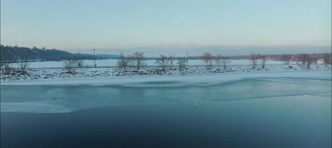 Person Walking Down Hudson Dike In Winter In Hudson WI - Drone Shot Stock Footage 229760979