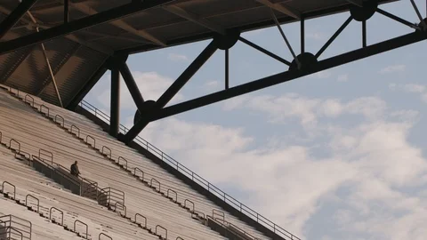 A person walking down the top of a stadium Video stock 102132141