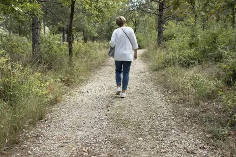 Person Walking on Forest Path Stock Photos