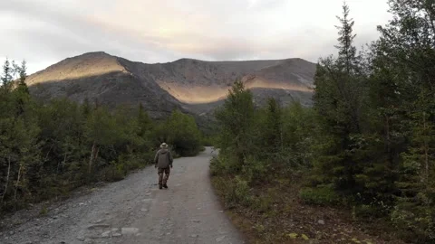 A person walking to the largest mountain range on the Kola Peninsula Stock Footage 164373321