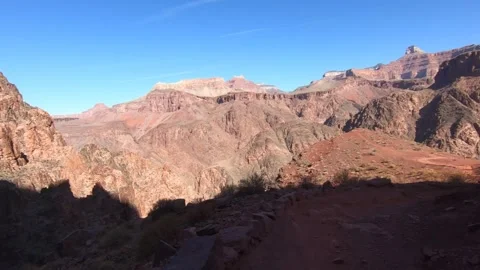 Person Walking to Mountain Edge Overlooking Grand Canyon – Footage Stock Footage 298411921