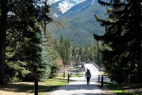 Person walking on a mountain path Stock Photos