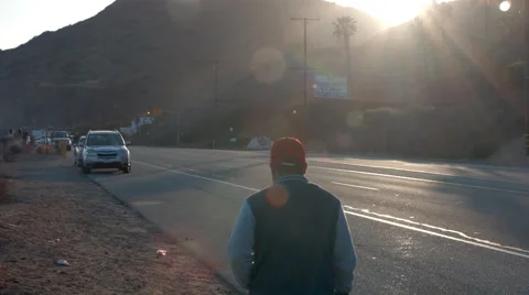 Person Walking at Sunset Vídeo Stock 63613015