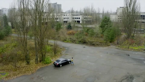 Person walking through abandoned city of Pripyat near Chernobyl Stock-Footage 332829889