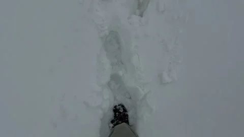 Person Walking Through Deep Snow - POV Low Angle Shot Vidéo 334119743