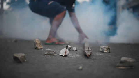 Person walking through rubble and smoke aftermath Stock-Footage 345860561