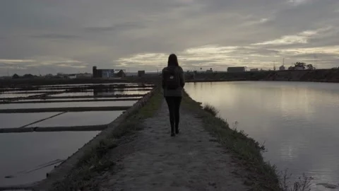 Person Walking Through Salinas de Aveiro Video stock 237876796