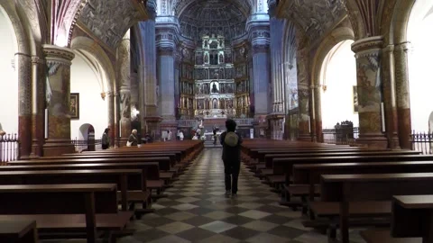Person Walking Towards Altar Inside Monasterio de San Jeronimo Stock Footage 336007721