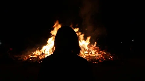Person walking towards fire Stock Footage 122803836