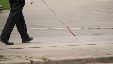 Person walking with a white cane Stock Footage 230924190