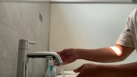 A person washes their Stock Footage 341303648
