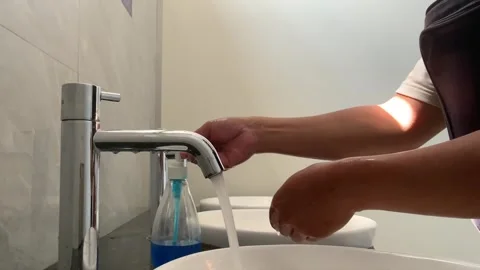 Person washing hands with Stock Footage 341303330