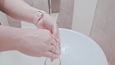 Person Washing Hands Under Running Bathroom Faucet Stock Footage 346036064