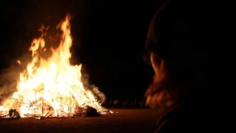 Person watching over a massive fire at an event Stock Footage 122307044