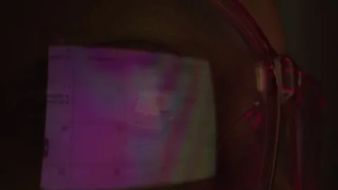Person Wearing Glasses with Reflection of Computer Screen in Them Stock Footage 276692951