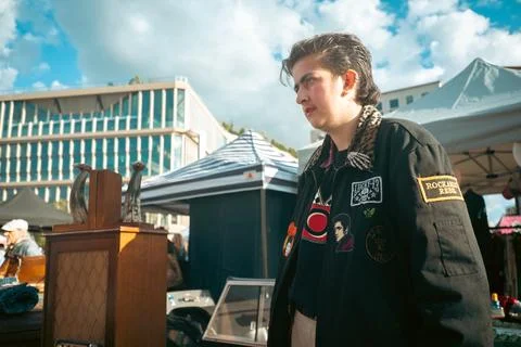 Person Wearing Patch Jacket at Classic Car Boot Sale London Stock Photos