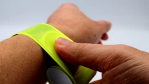 A person wearing reflective material on their wrist. Video stock 336293771