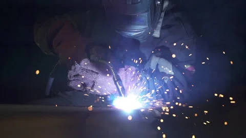 Person is welding metal object in construction site. Slow motion Stock Footage 157115096
