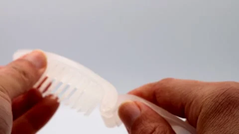 The person who assembles the comb Stock Footage 336339885
