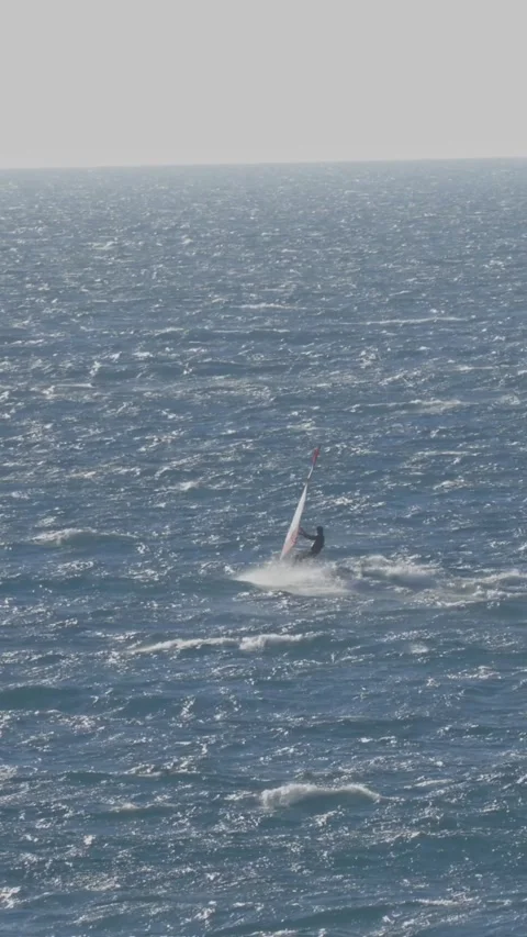 A person windsurfing in the ocean Video stock 328670272