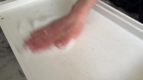 Person wiping folding table with cloth, cleaning surface and household hygiene 動画素材 337109604