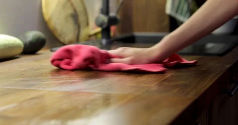 Person wiping surface of table with rag Stock Footage 113599249