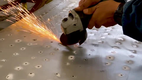 Person working with angle grinder and making sparks, close up Stock Footage 247492037