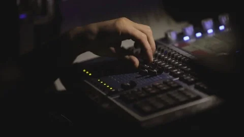 A person is working behind the control panel. Video stock 74386316