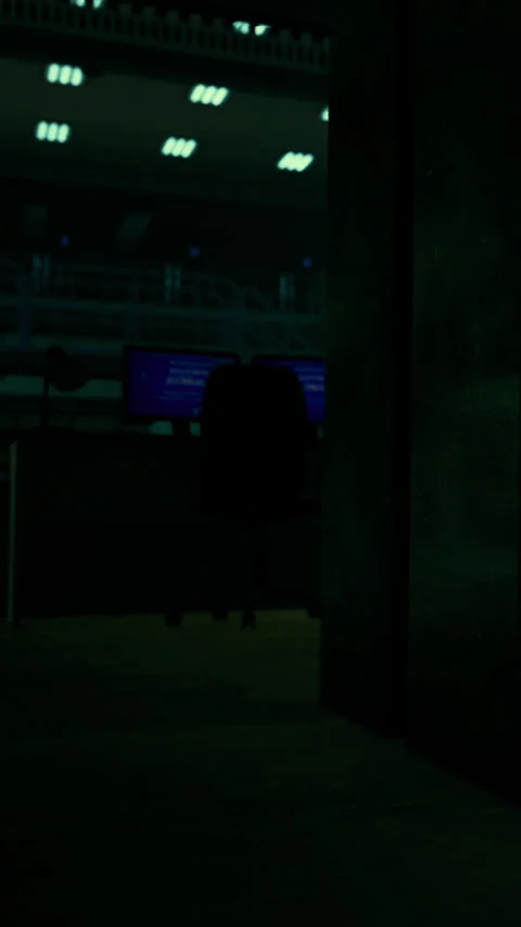 Person working at a computer in a dark space during night hours Stock Footage 336027789