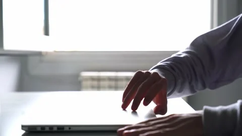 Person working with the computer from home at their desk. Hands using laptop  Stock Footage 133233761